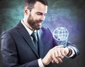 Businessman pressing on icons on smartwatch. Royalty Free Stock Photo