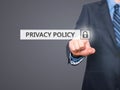 Businessman pressing Privacy Policy button on virtual screens Royalty Free Stock Photo