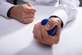 Businessman Pressing Stress Ball