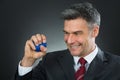 Businessman Pressing Stressball In Hand Royalty Free Stock Photo