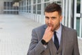 Businessman pretending to puke in office space