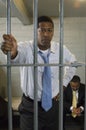Businessman In Prison Cell Royalty Free Stock Photo