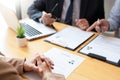 Businessman professional women in suit explaining about her profile to business managers holding reading a resume, interview the Royalty Free Stock Photo