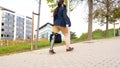 Businessman with prosthetic leg walking along an urban park