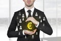 Businessman protecting euro symbol Royalty Free Stock Photo