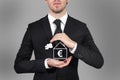 Businessman protecting euro symbol in home with his hands Royalty Free Stock Photo