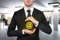 Businessman protecting at sign