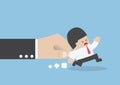Businessman pulled by large hand Royalty Free Stock Photo