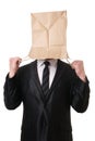 Businessman pulling paper bag over his head Royalty Free Stock Photo