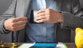Businessman pulls his leather wallet into suit pocket