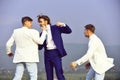 Businessman punching, hitting colleague, twin men in formal outfit Royalty Free Stock Photo