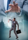 Businessman puppet being manipulated by boss Royalty Free Stock Photo