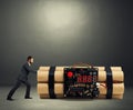 Businessman pushing big bomb with timer Royalty Free Stock Photo