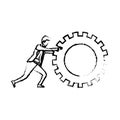 Businessman pushing a big gear cogwheel silhouette blurred monochrome
