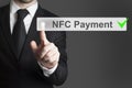 Businessman pushing button nfc payment Royalty Free Stock Photo
