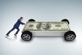 The businessman pushing car in business concept Royalty Free Stock Photo