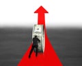 Businessman pushing money circle on red arrow Royalty Free Stock Photo