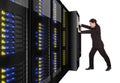 Businessman pushing server rack in place Royalty Free Stock Photo