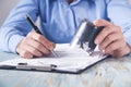 Businessman puts a stamp on the documents in the office