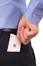 Businessman putting ace card in back pocket. Royalty Free Stock Photo