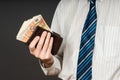 Businessman putting banknotes in his wallet. Stack of fifty euros money. Business man is holding cash. Person pays in euro bills Royalty Free Stock Photo