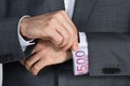 Businessman Putting Bribe In Suit Sleeve Royalty Free Stock Photo