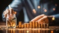 Businessman putting coin to money jar, Saving money for prepare in the future