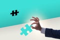 Businessman putting missing jigsaw puzzle piece Royalty Free Stock Photo