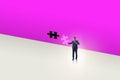 Businessman putting missing jigsaw puzzle piece Royalty Free Stock Photo