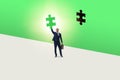 Businessman putting missing jigsaw puzzle piece Royalty Free Stock Photo