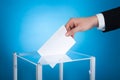 Businessman putting paper in election box Royalty Free Stock Photo