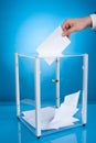 Businessman putting paper in election box Royalty Free Stock Photo