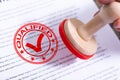 Businessman Putting Qualified Stamp On Document Royalty Free Stock Photo