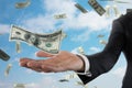 Businessman with rainy banknotes over sky background. Concept of success, career and big income Royalty Free Stock Photo