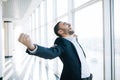 Businessman raising fist and celebrating victory