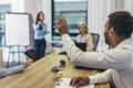 Businessman raising her hand to ask the question on a seminar in board room Royalty Free Stock Photo