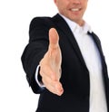 Businessman reaches out his hand Royalty Free Stock Photo