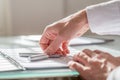 Businessman reaching for his fountain pen Royalty Free Stock Photo