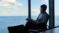 Businessman reading contract papers at sea view. Thinking manager analyzing data Royalty Free Stock Photo