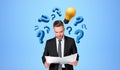 Businessman reading contract with question markes and lightbulb icons Royalty Free Stock Photo