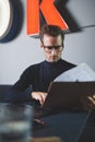 Businessman reading documents at his desk in a modern office Royalty Free Stock Photo