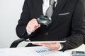 Businessman reading documents with magnifying glass Royalty Free Stock Photo