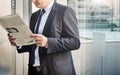 Businessman reading the financial news