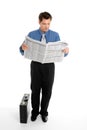 Businessman reading newspaper