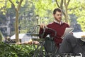 Businessman Reading Newspaper By Bicycle Royalty Free Stock Photo