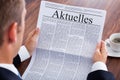 Businessman reading newspaper Royalty Free Stock Photo
