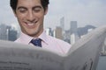 Businessman Reading Newspaper Outdoors Royalty Free Stock Photo