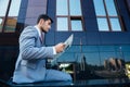 Businessman reading newspaper outdoors Royalty Free Stock Photo