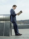 Businessman Reading Newspaper Outdoors Royalty Free Stock Photo