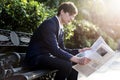 Businessman reading newspaper at a park Royalty Free Stock Photo